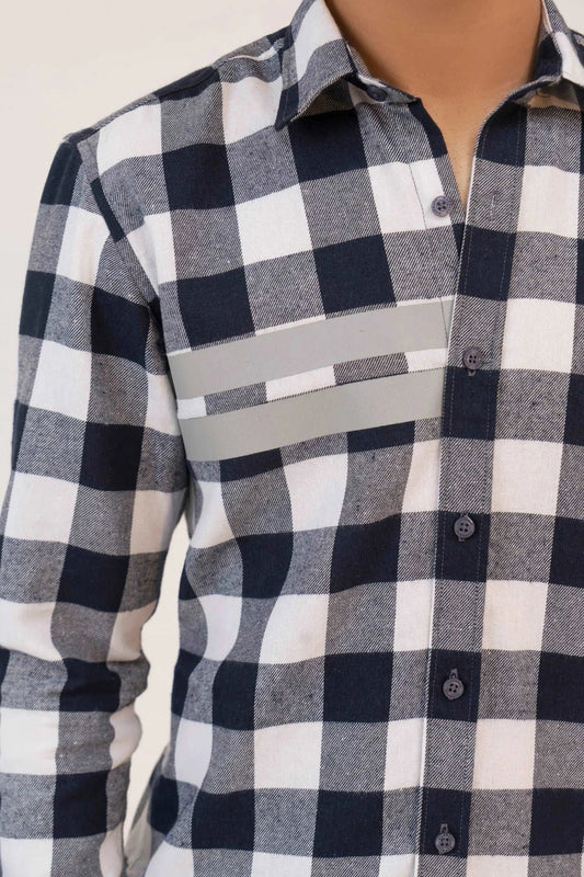 A man wearing a black and white checkered shirt