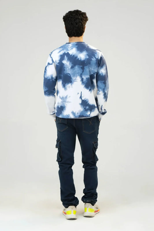 Back full-length view of Blue Tie Dye Camouflage sweatshirt with denim jeans