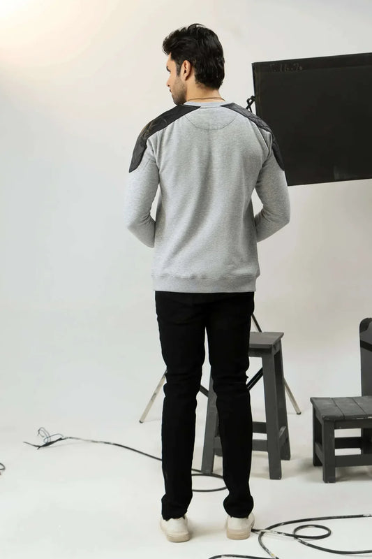 Back view of men’s gray sweatshirt with black shoulder panels