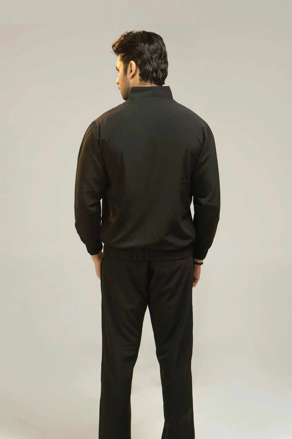 Black tracksuit back view