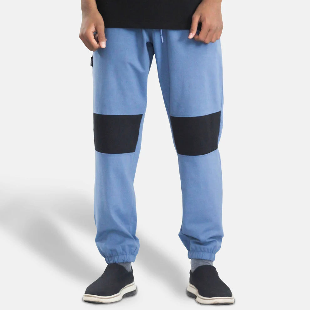 Blue jogger pants with black patches