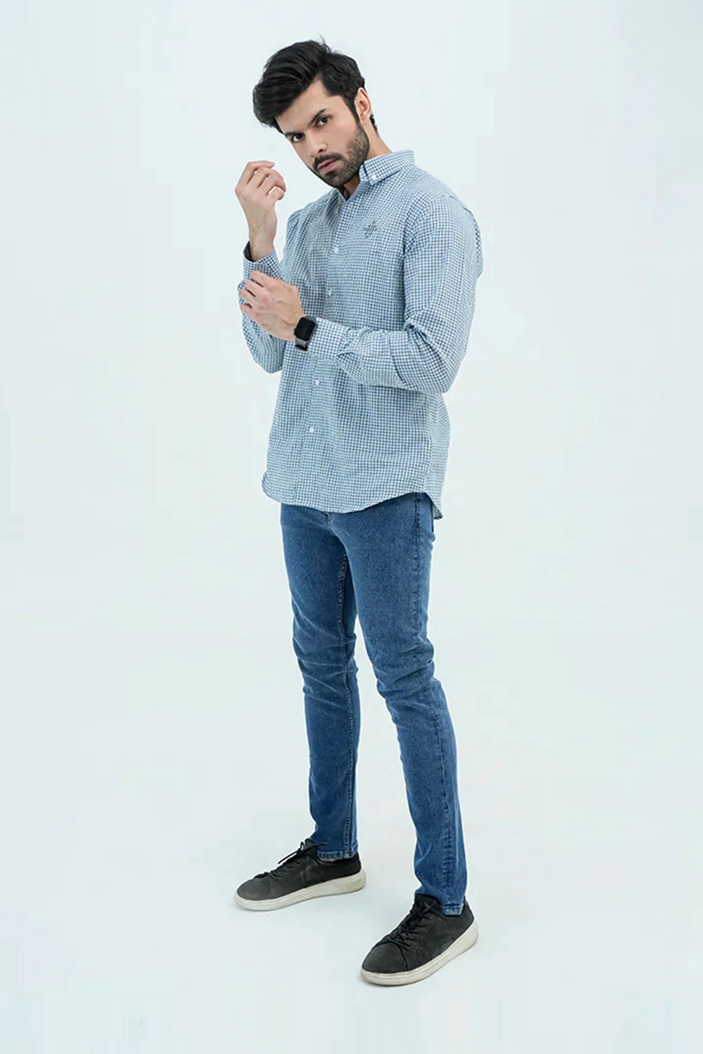 Man wearing checkered blue casual shirt with jeans