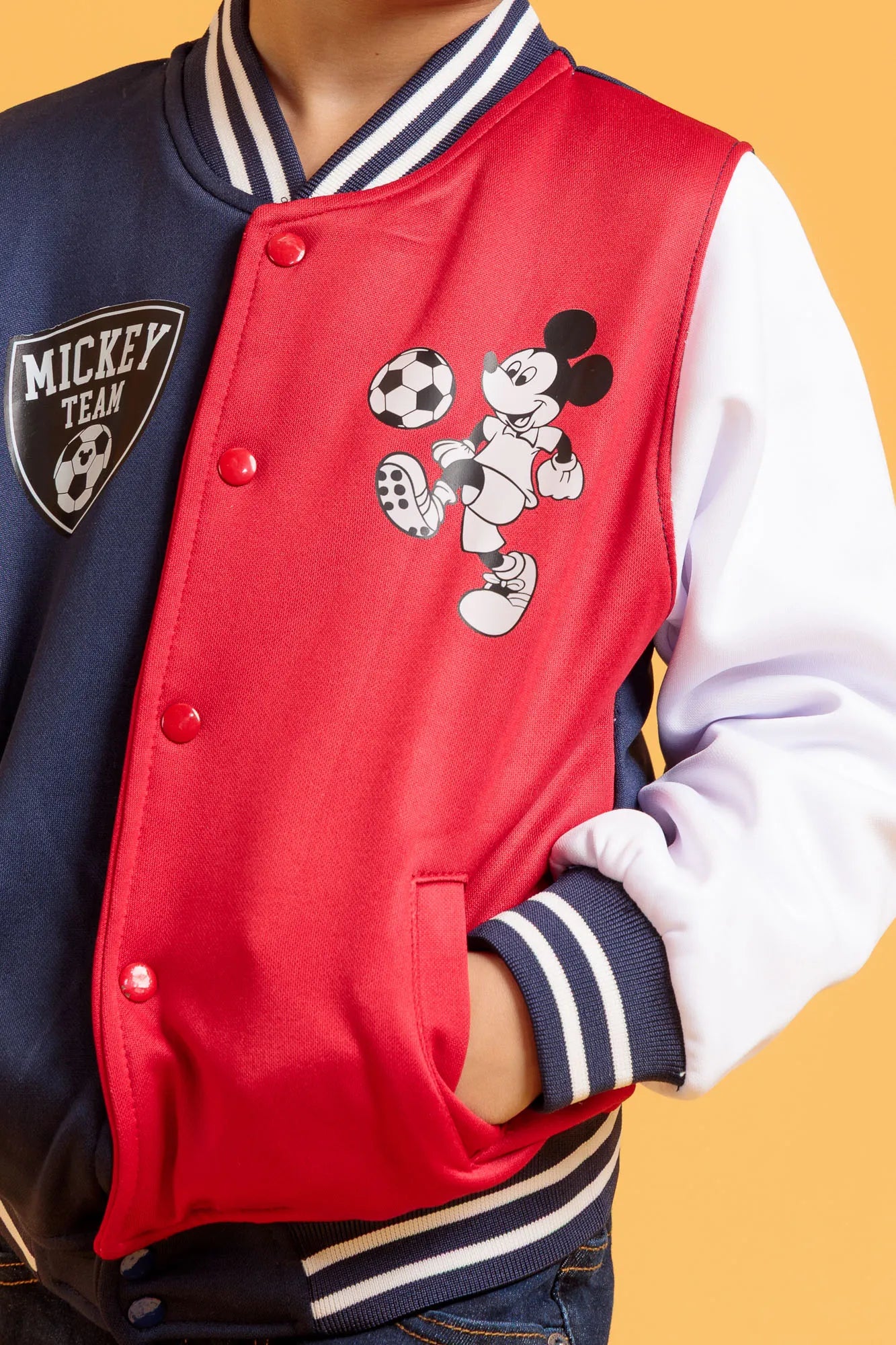 Close up of a little boy's baseball jacket design and fabric
