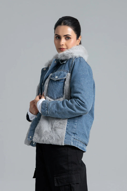 Woman wearing a denim jacket with fur trim