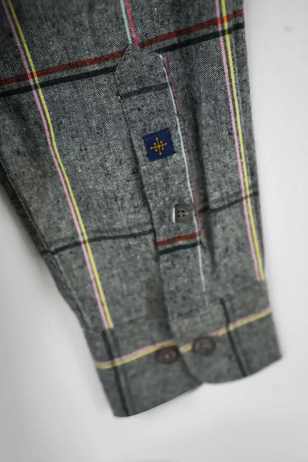 Gray plaid shirt with a small logo