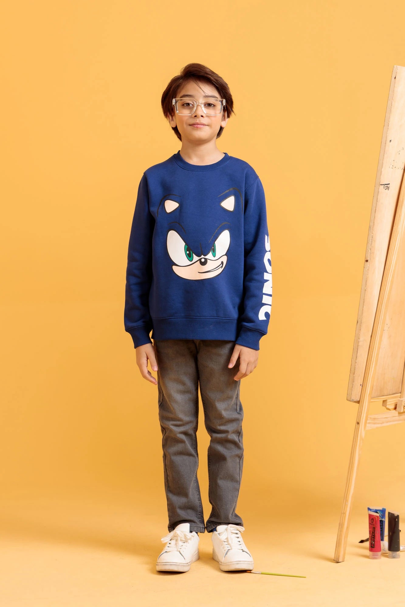Junior boys' casual outfit with a blue sweatshirt and trousers