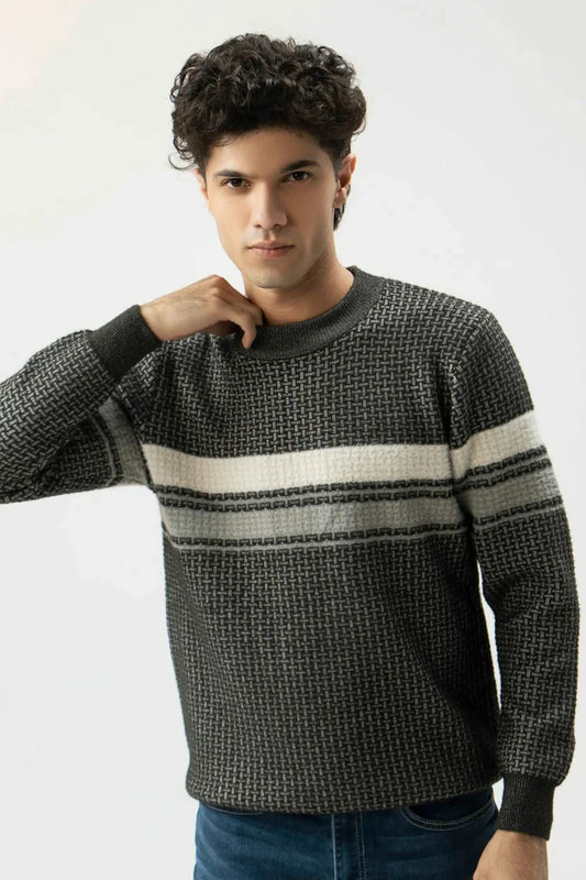 Man wearing a patterned sweater with a white background