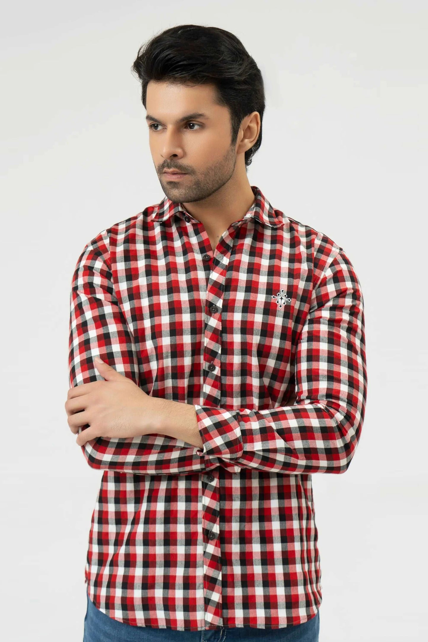 Man wearing a red and white checkered shirt on a white background