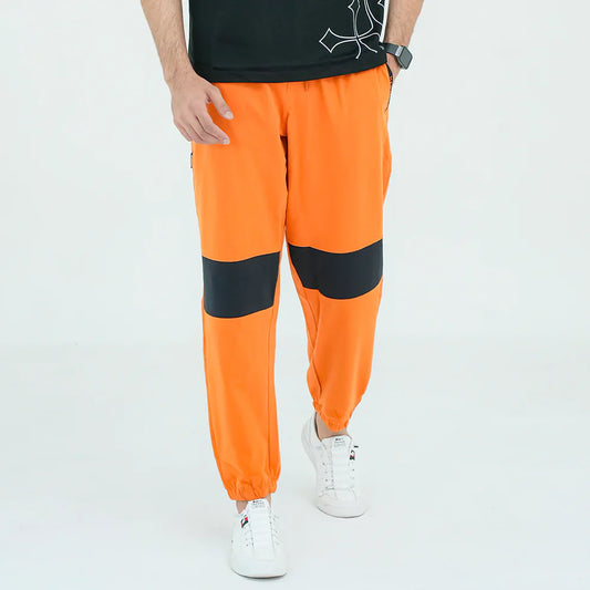 Person wearing bright orange pants