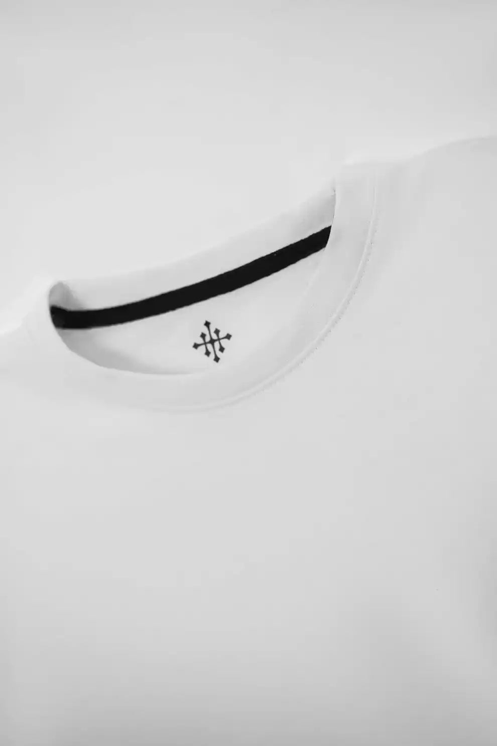 White t-shirt with a black logo