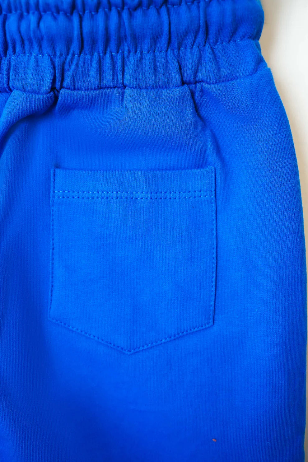 Close-up of a blue garment with a pocket