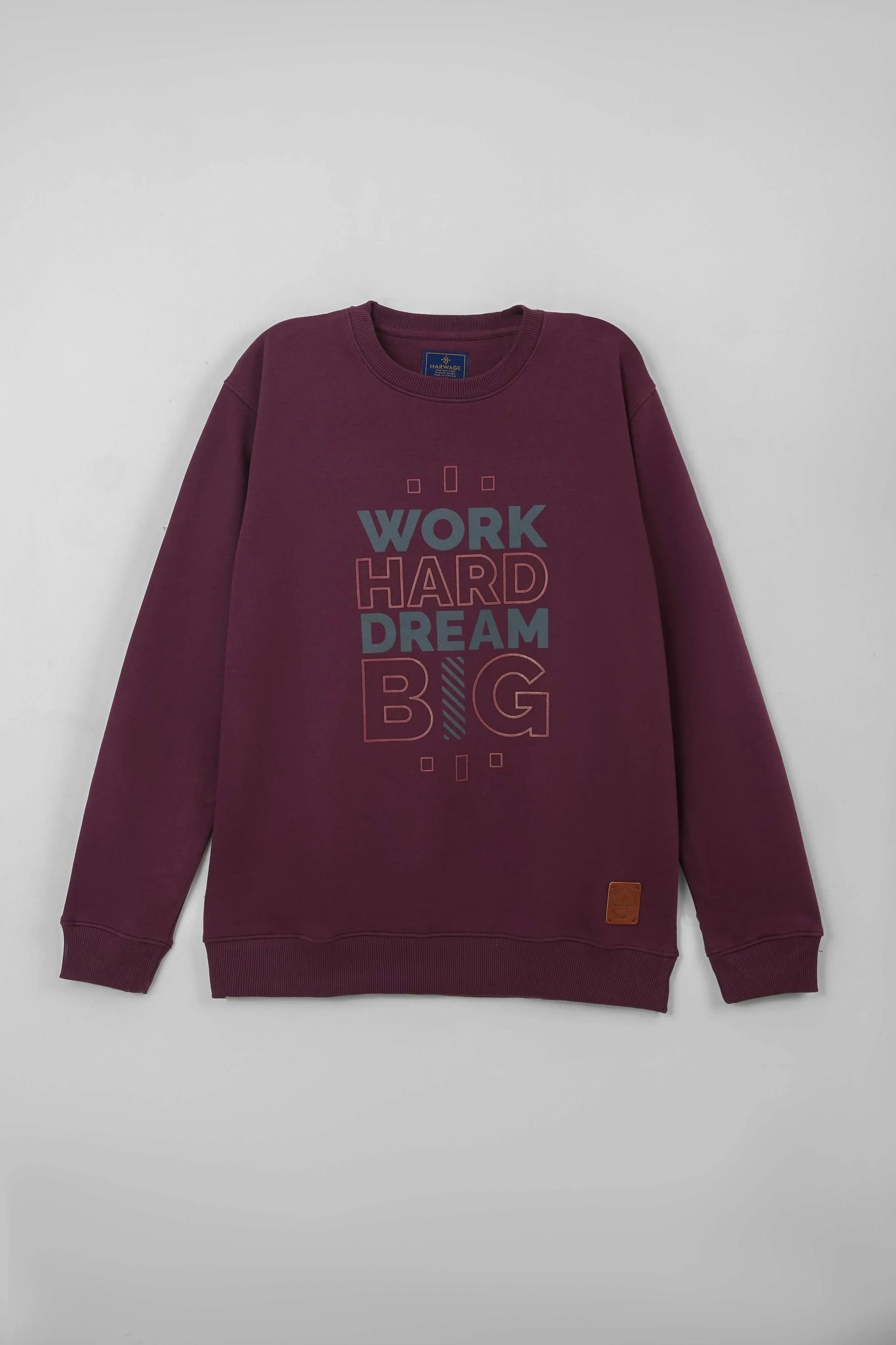 Centered display showing a maroon regular fit sweatshirt with a slogan design