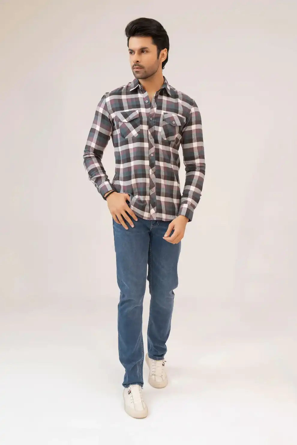A man wearing a checkered shirt