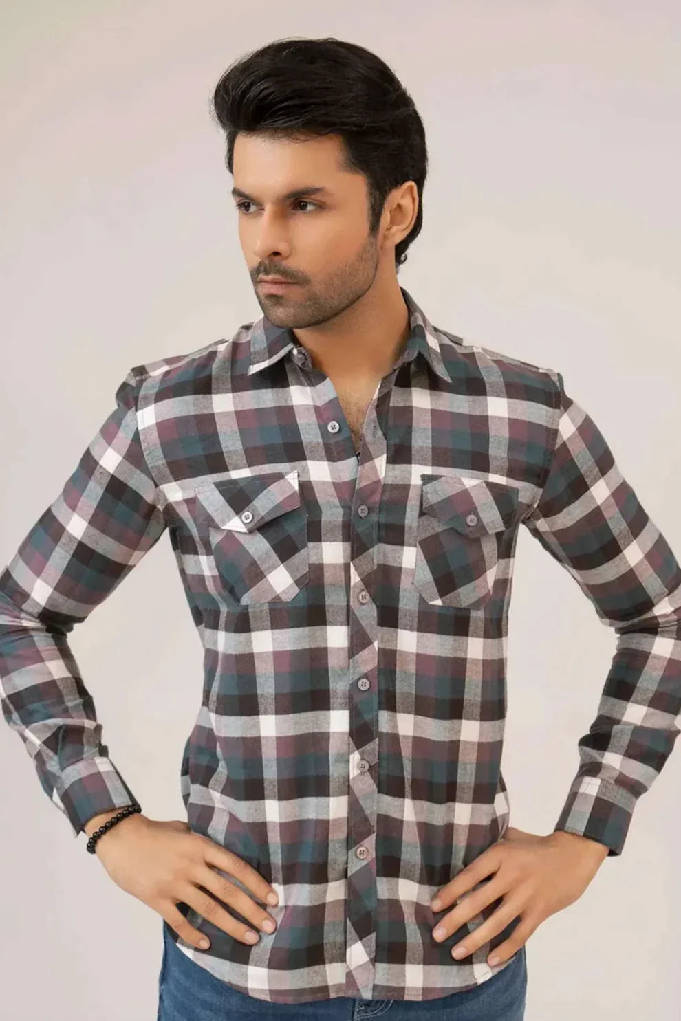 A man wearing a plaid shirt
