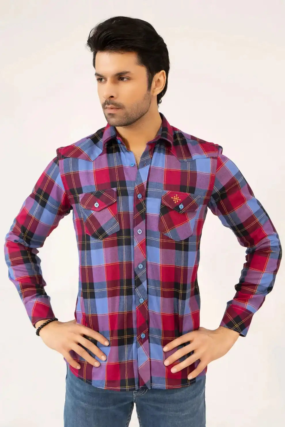 A man wearing a red and blue plaid shirt