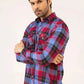 A man wearing a stylish plaid shirt 