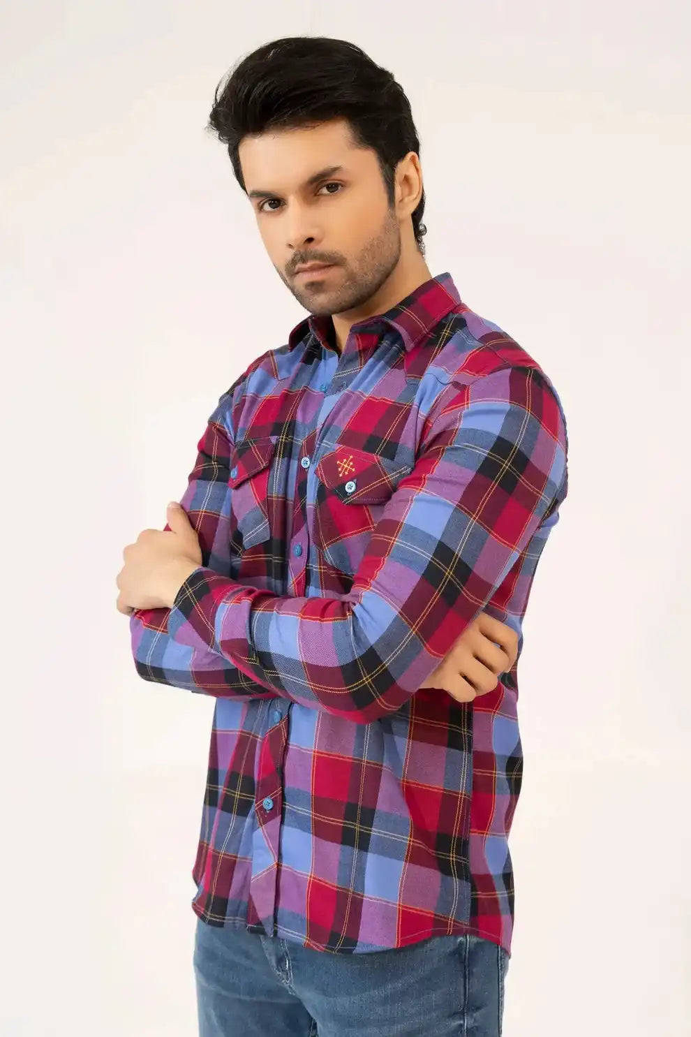 A man wearing a stylish plaid shirt 