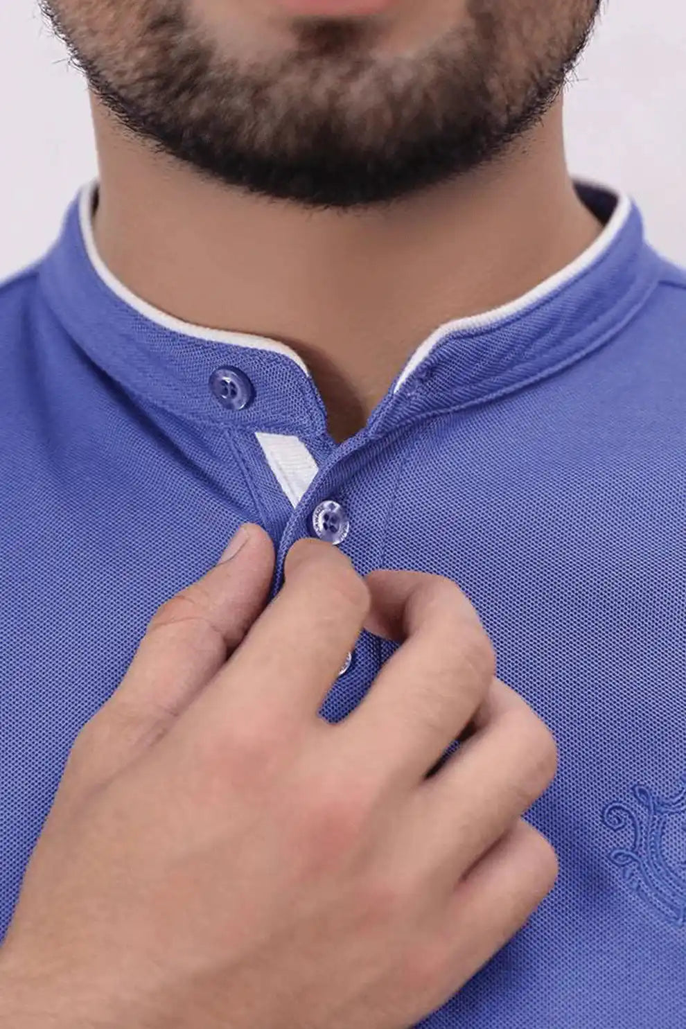 A person wearing a blue polo shirt 