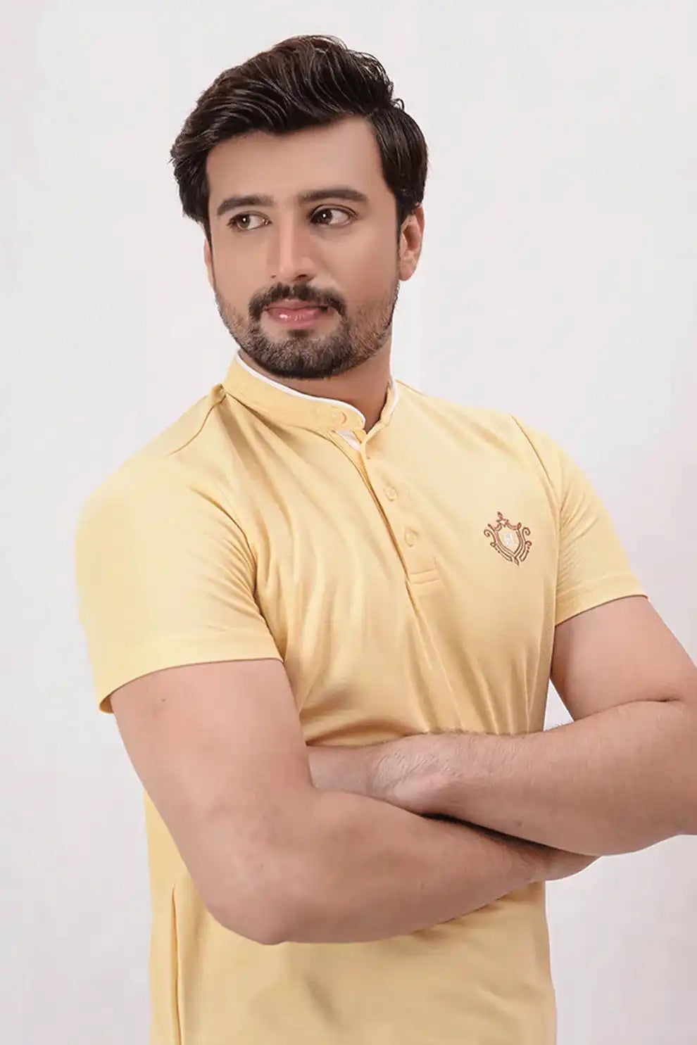 A yellow polo shirt with a brand logo