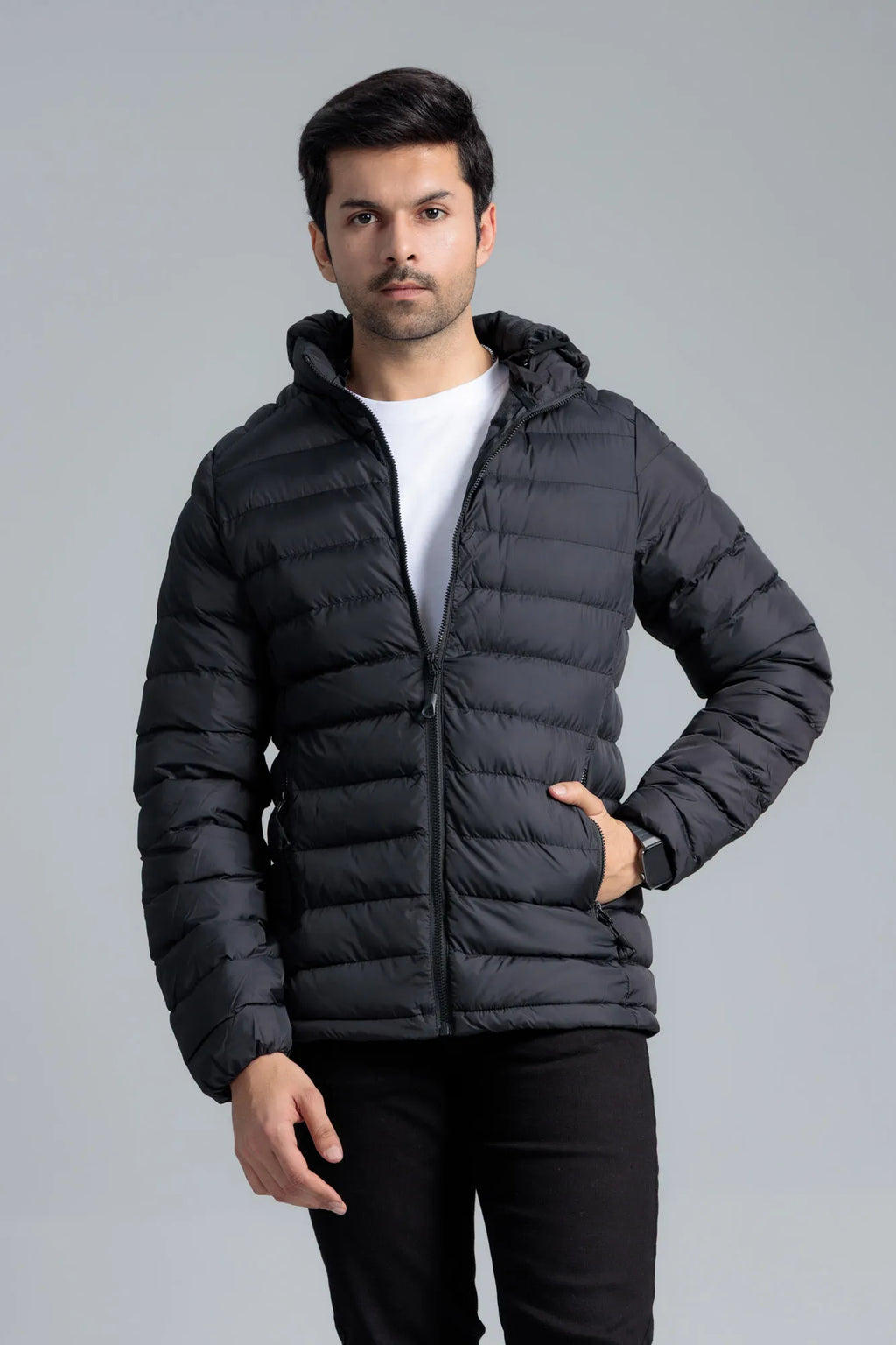 Action pose wearing a Black Men’s Puffer Jacket with relaxed fit