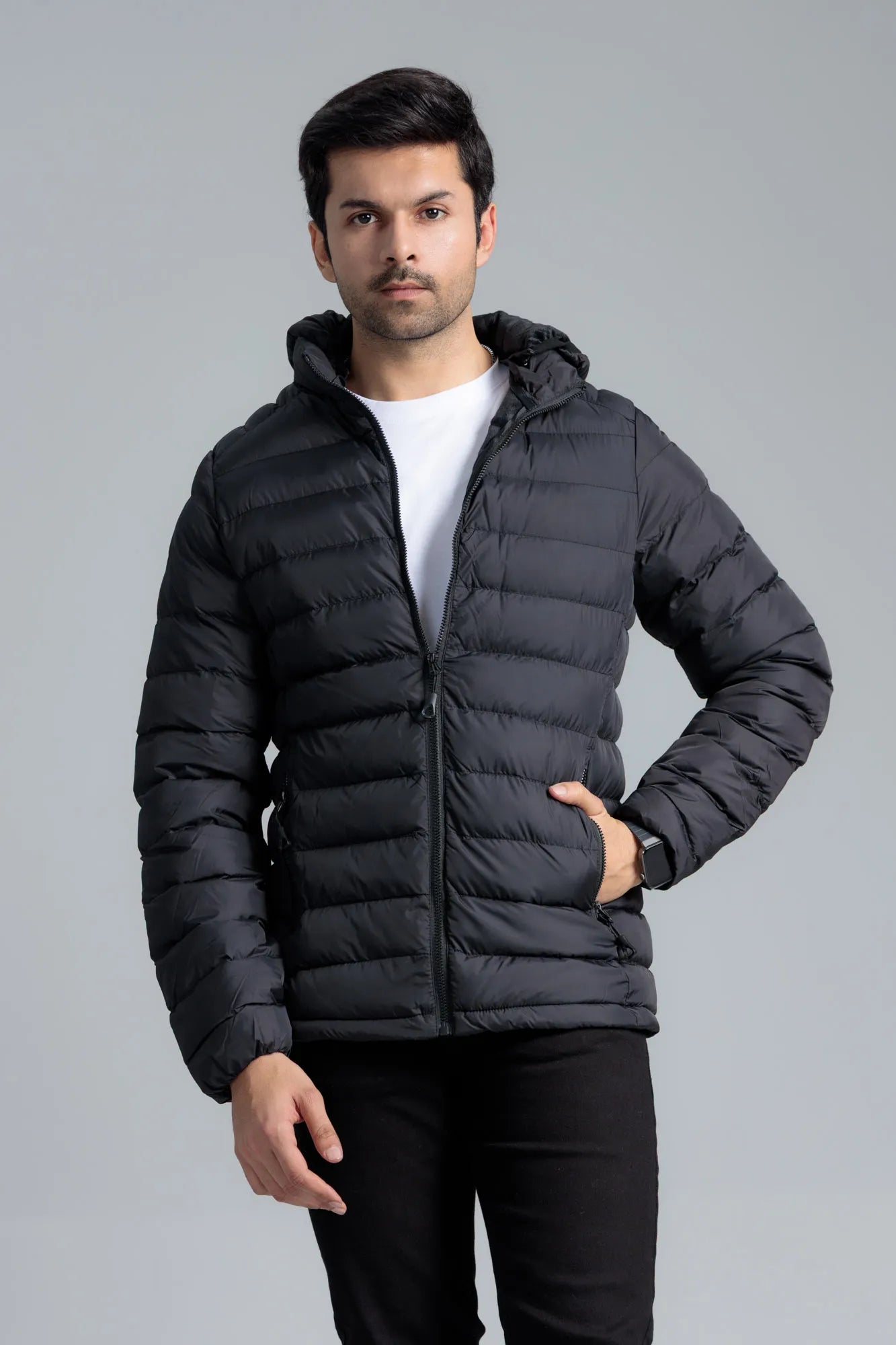 Action pose wearing a Black Men’s Puffer Jacket with relaxed fit