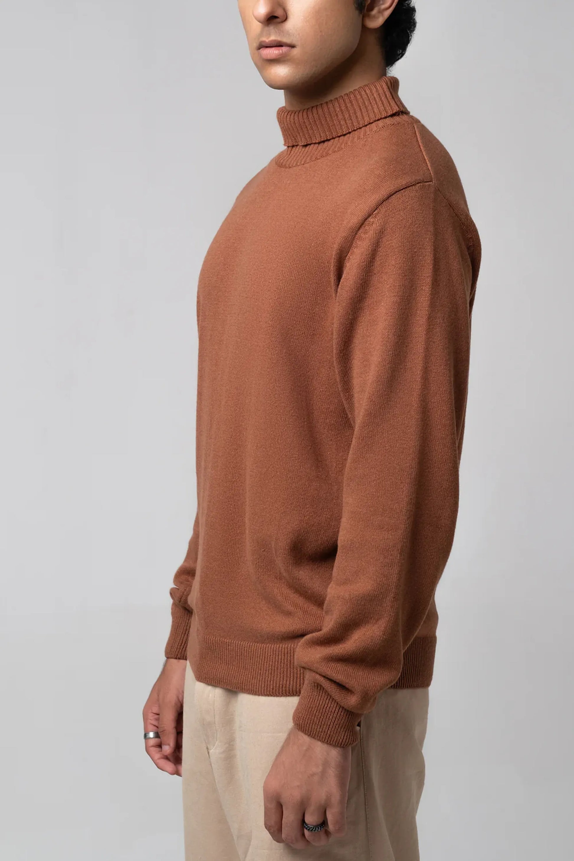 Angled view highlighting fit of Turtle Neck Sweater Brown