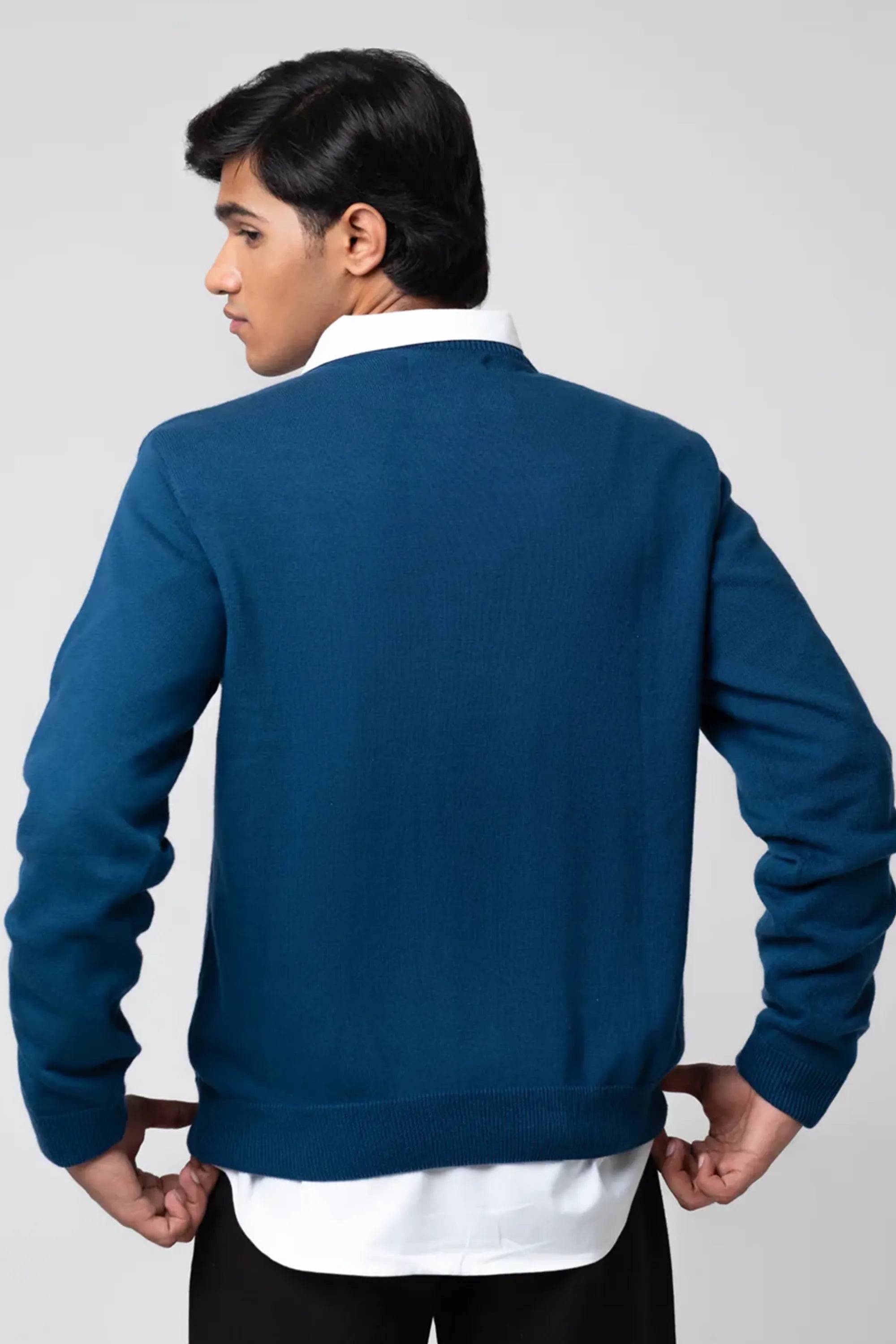 Back standing view of crew neck sweater navy from behind
