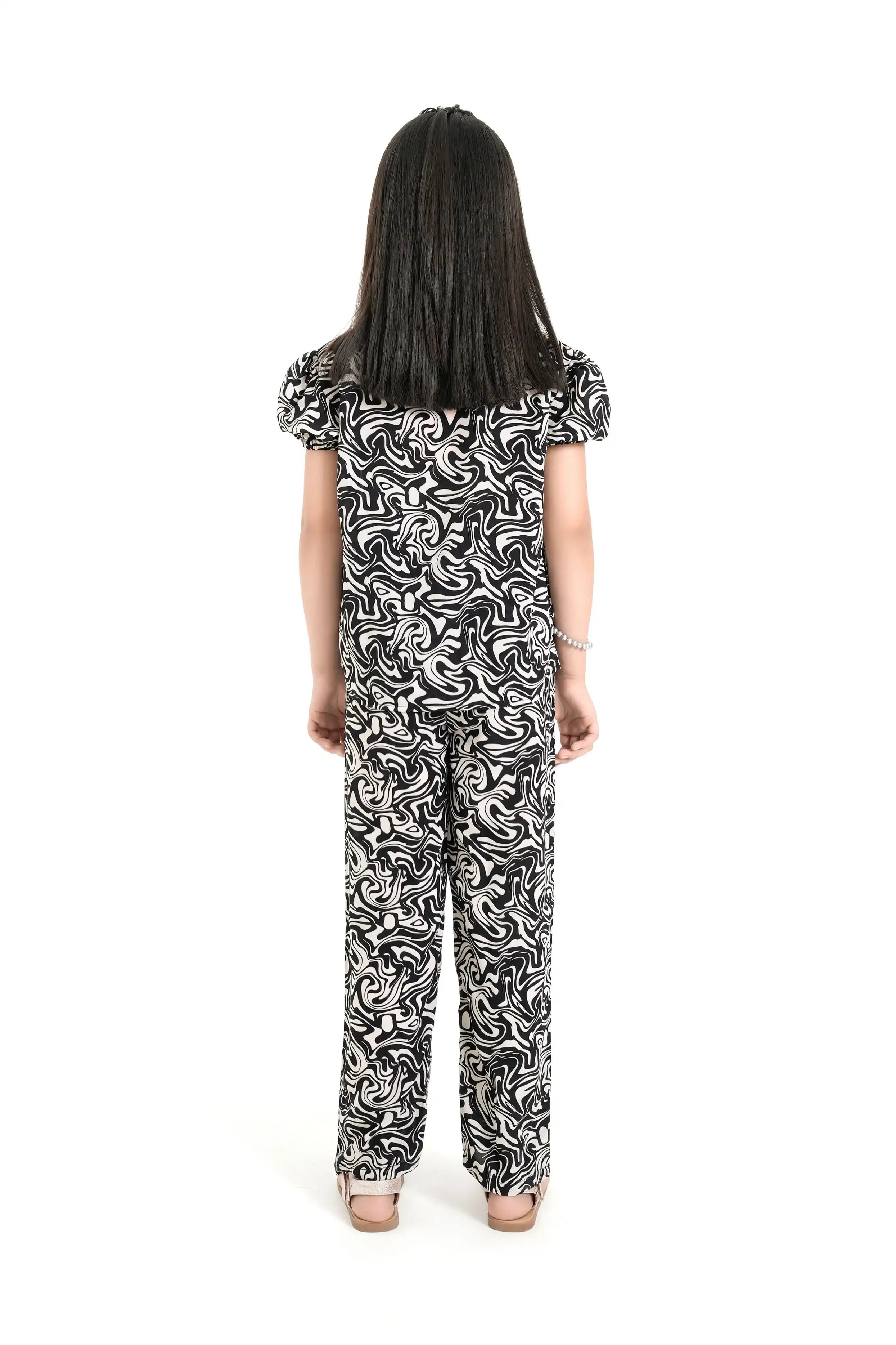 Back view of a girls’ black co-ord set