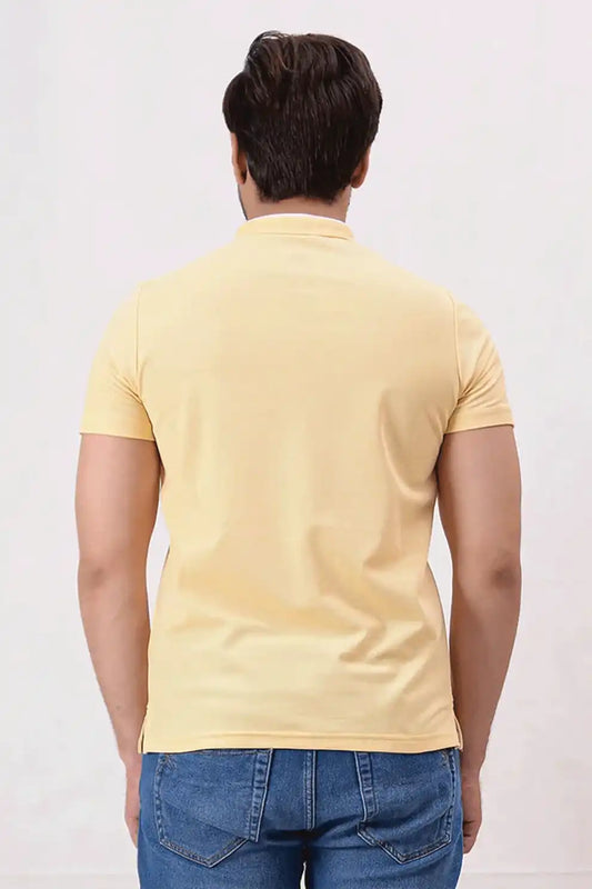 Back view of a yellow polo shirt 