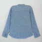 Back view of light blue long-sleeve shirt