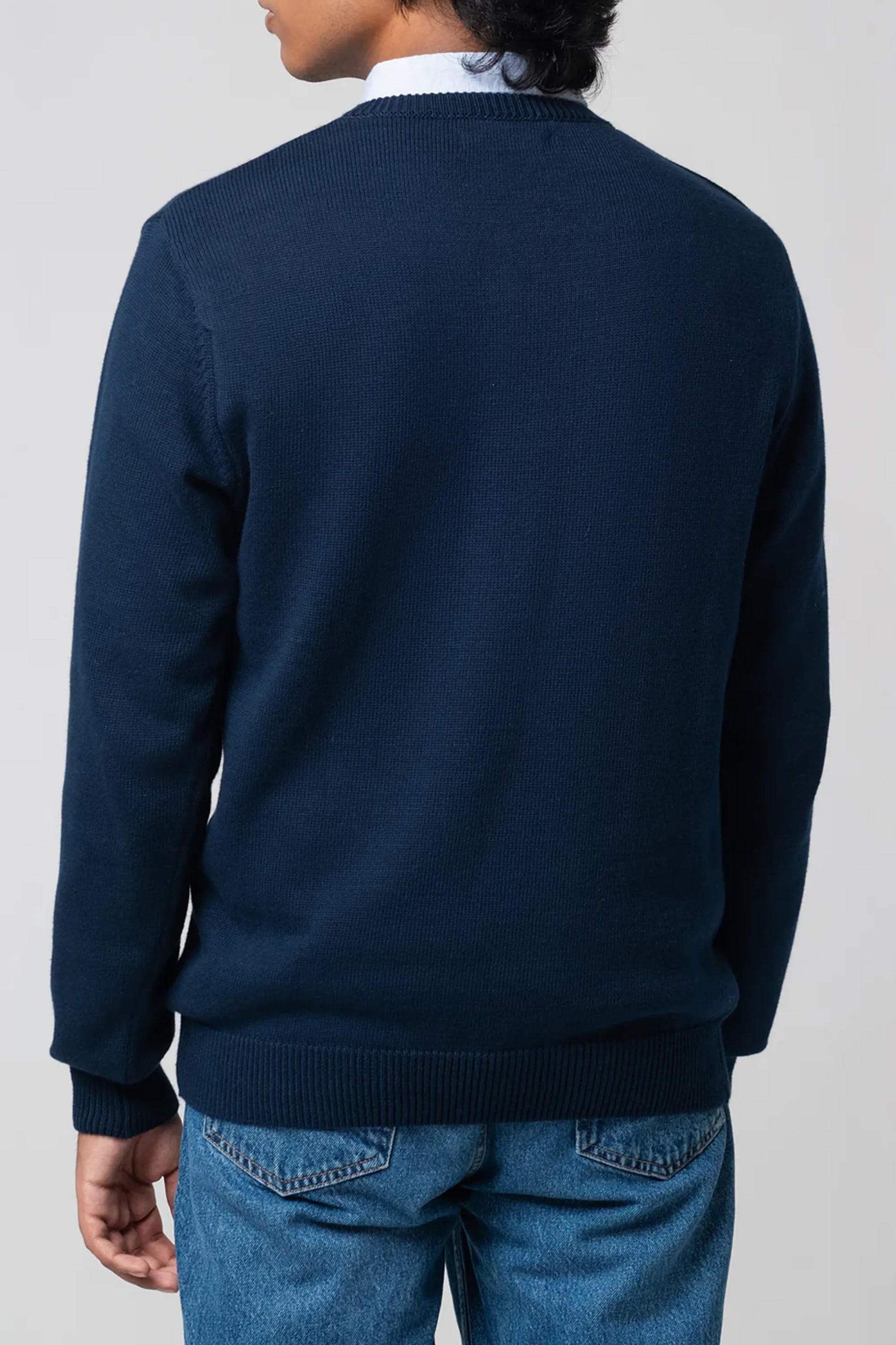 Back view of men's v neck cardigan navy showing relaxed fit