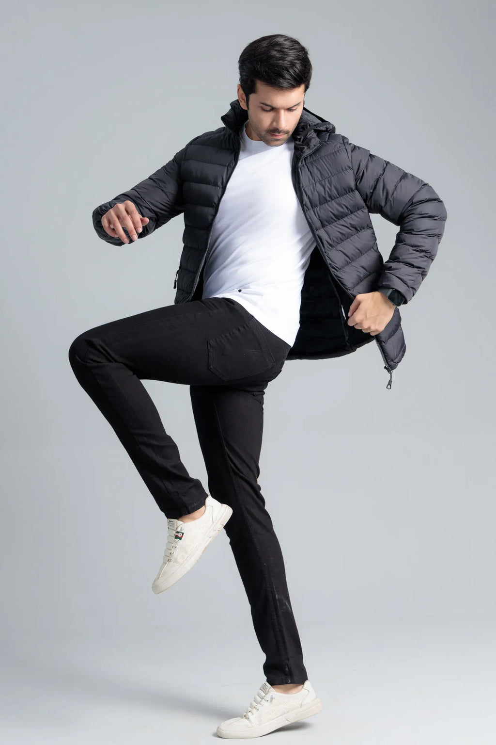 Black Men’s Puffer Jacket worn open with a t-shirt underneath