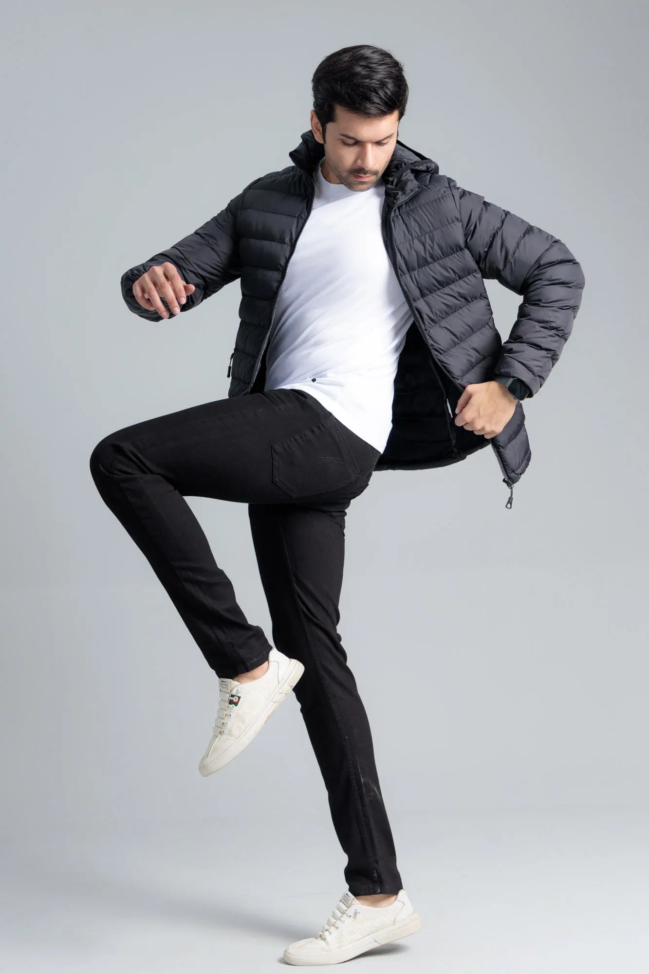 Black Men’s Puffer Jacket worn open with a t-shirt underneath