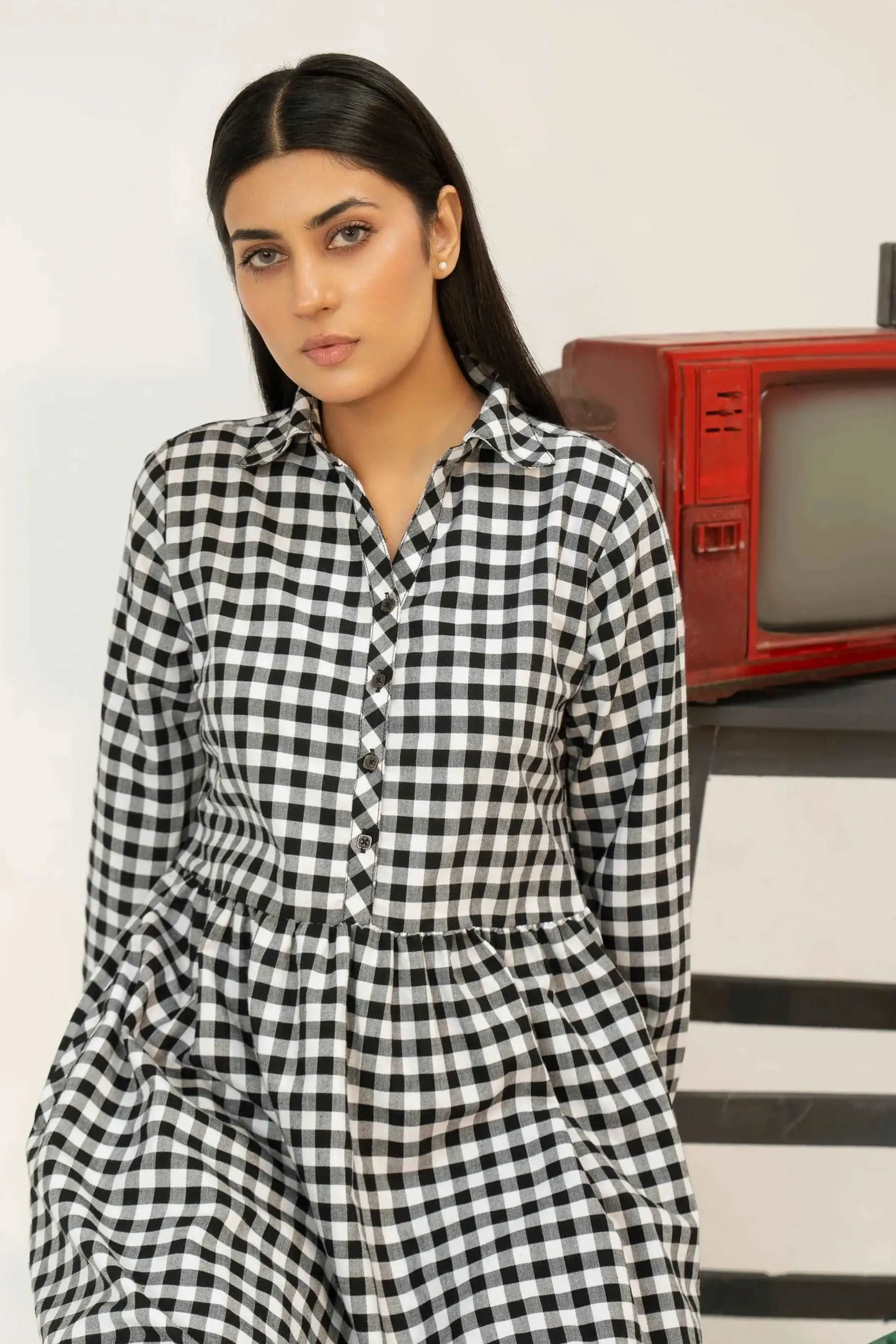 Woman wearing a black and white checkered dress