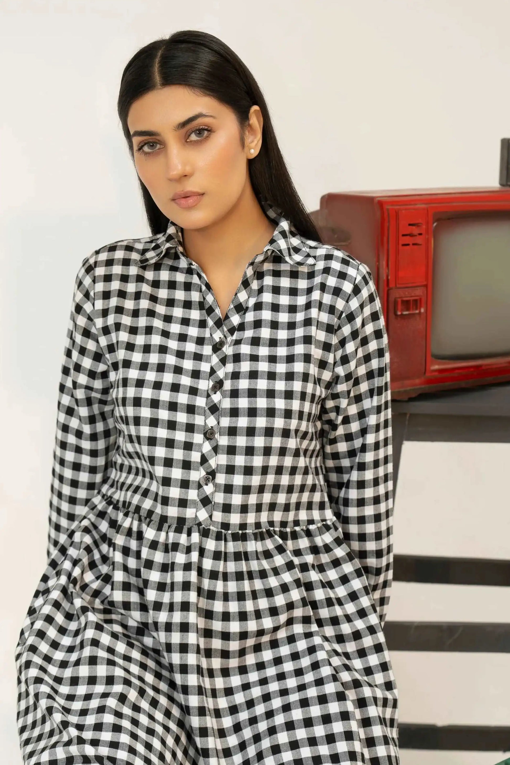 Woman wearing a black and white checkered dress