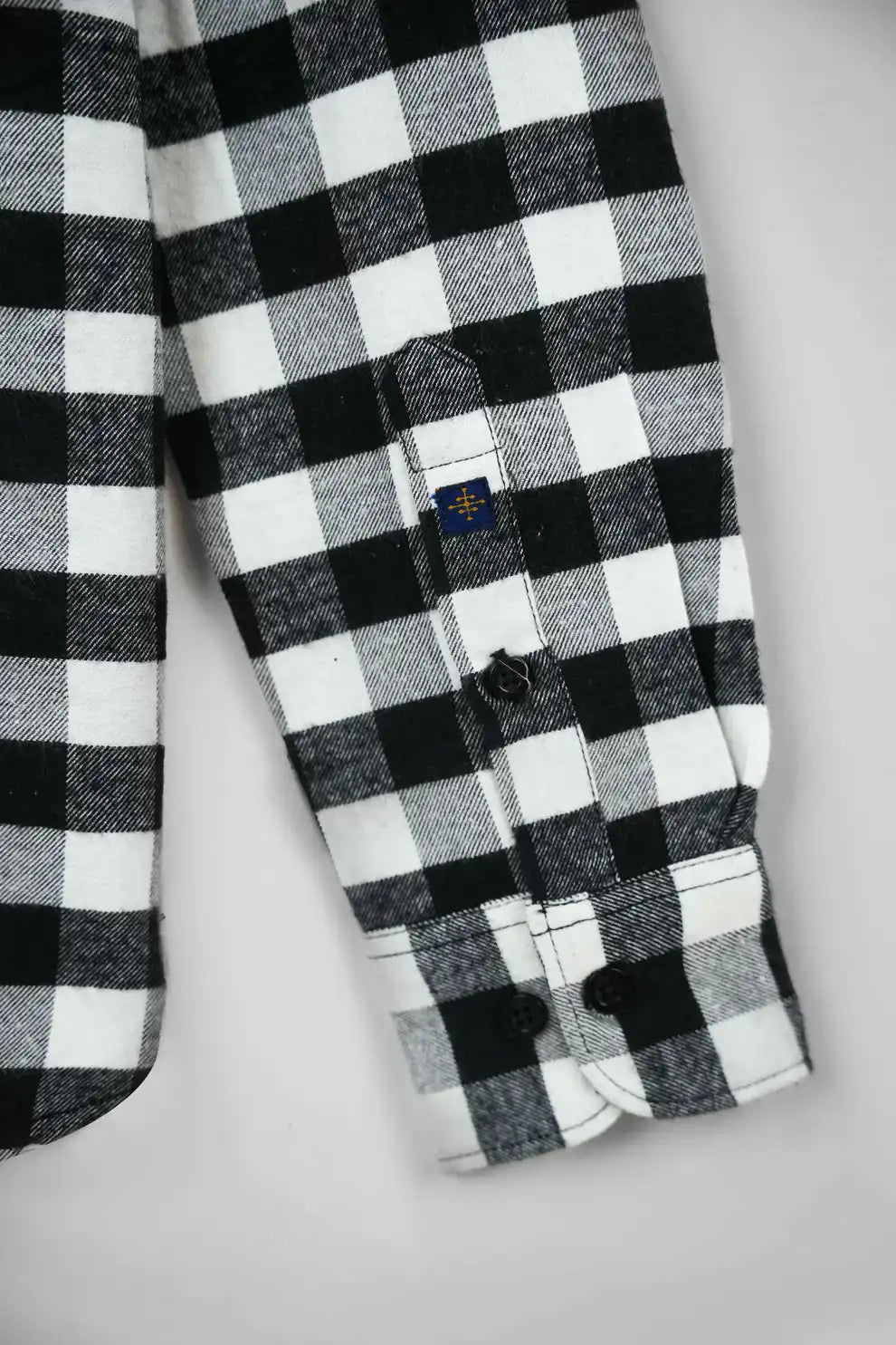 Black and white checkered shirt with brand logo