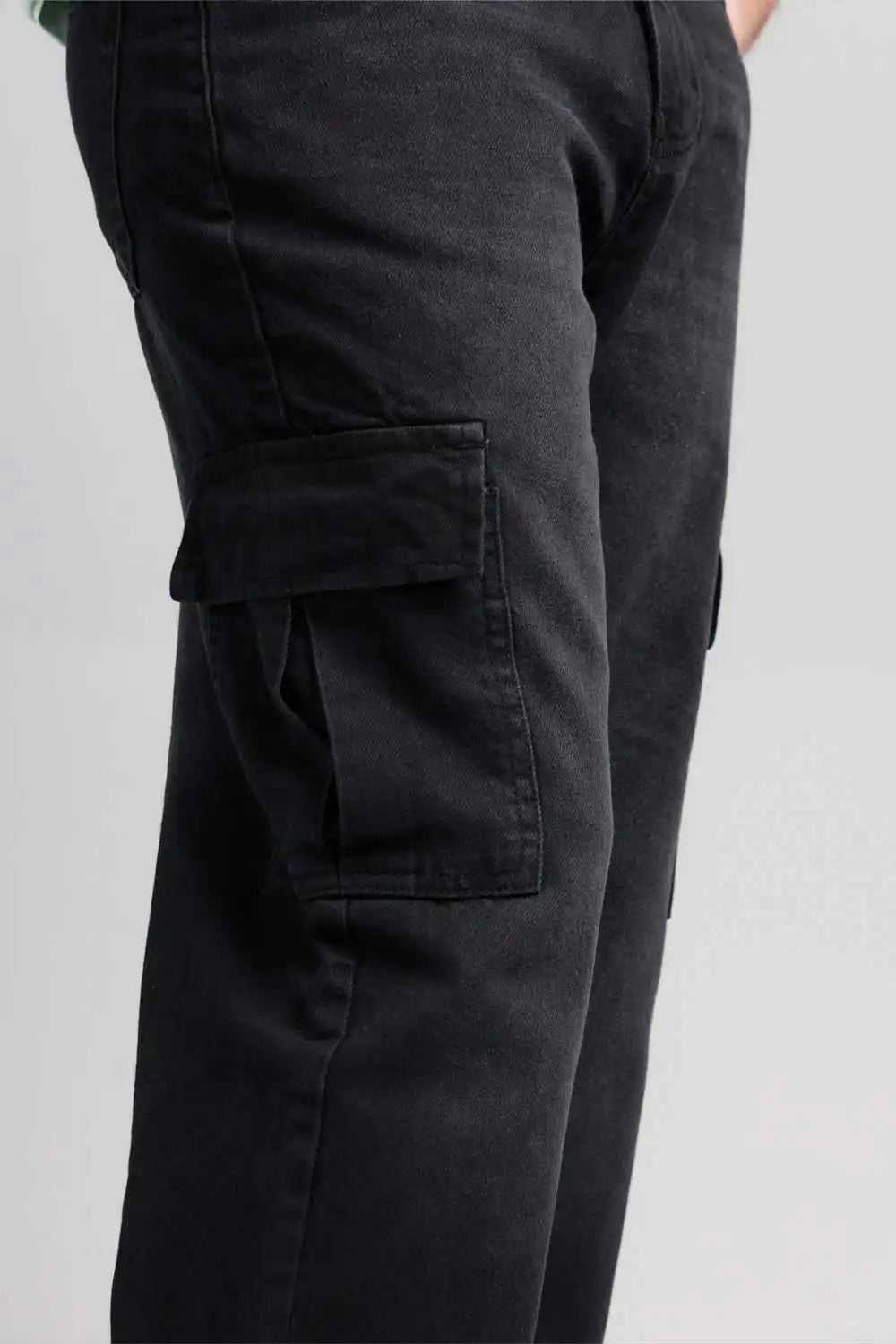 Black cargo pants on a gray background