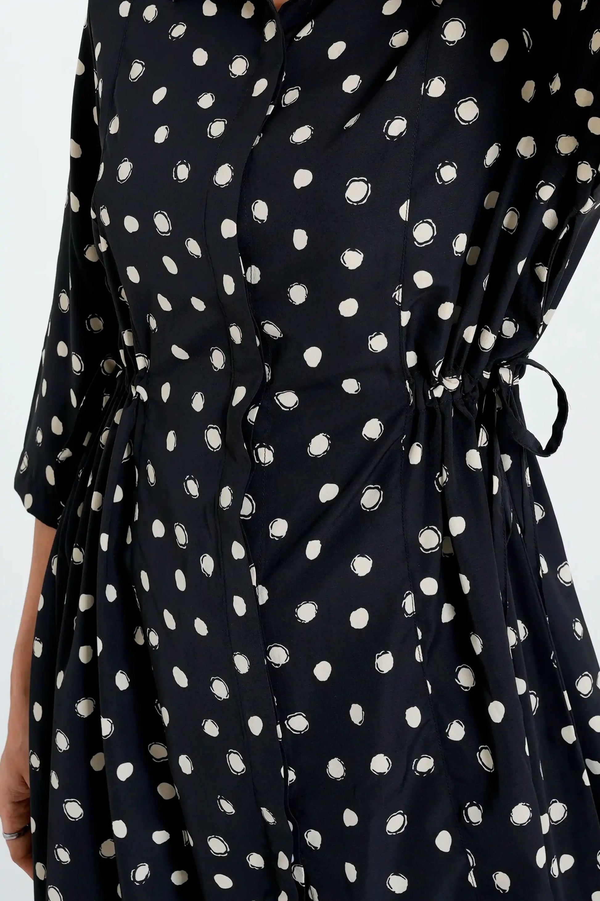 Black dress with white polka dot pattern