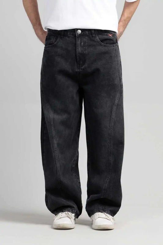 A person wearing black jeans and a white shirt