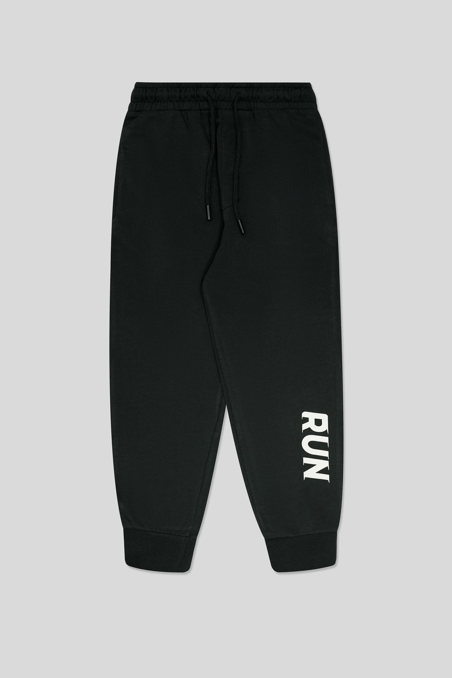 Black jogger pants with 'RUN' printed 