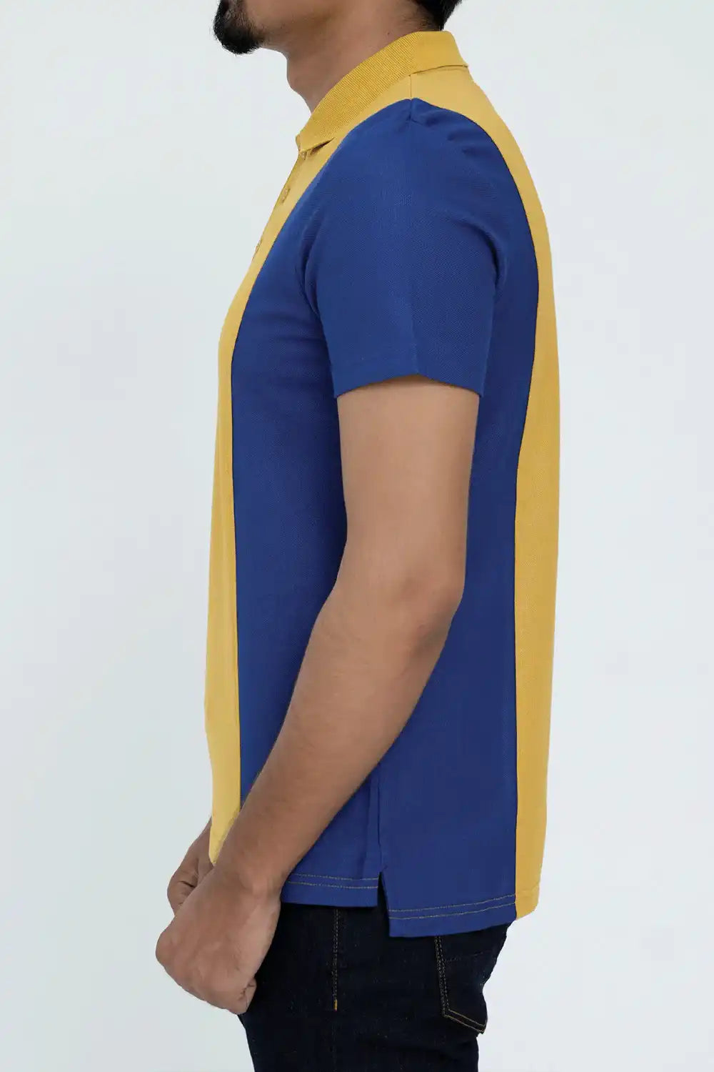 Model wearing a blue and yellow polo shirt
