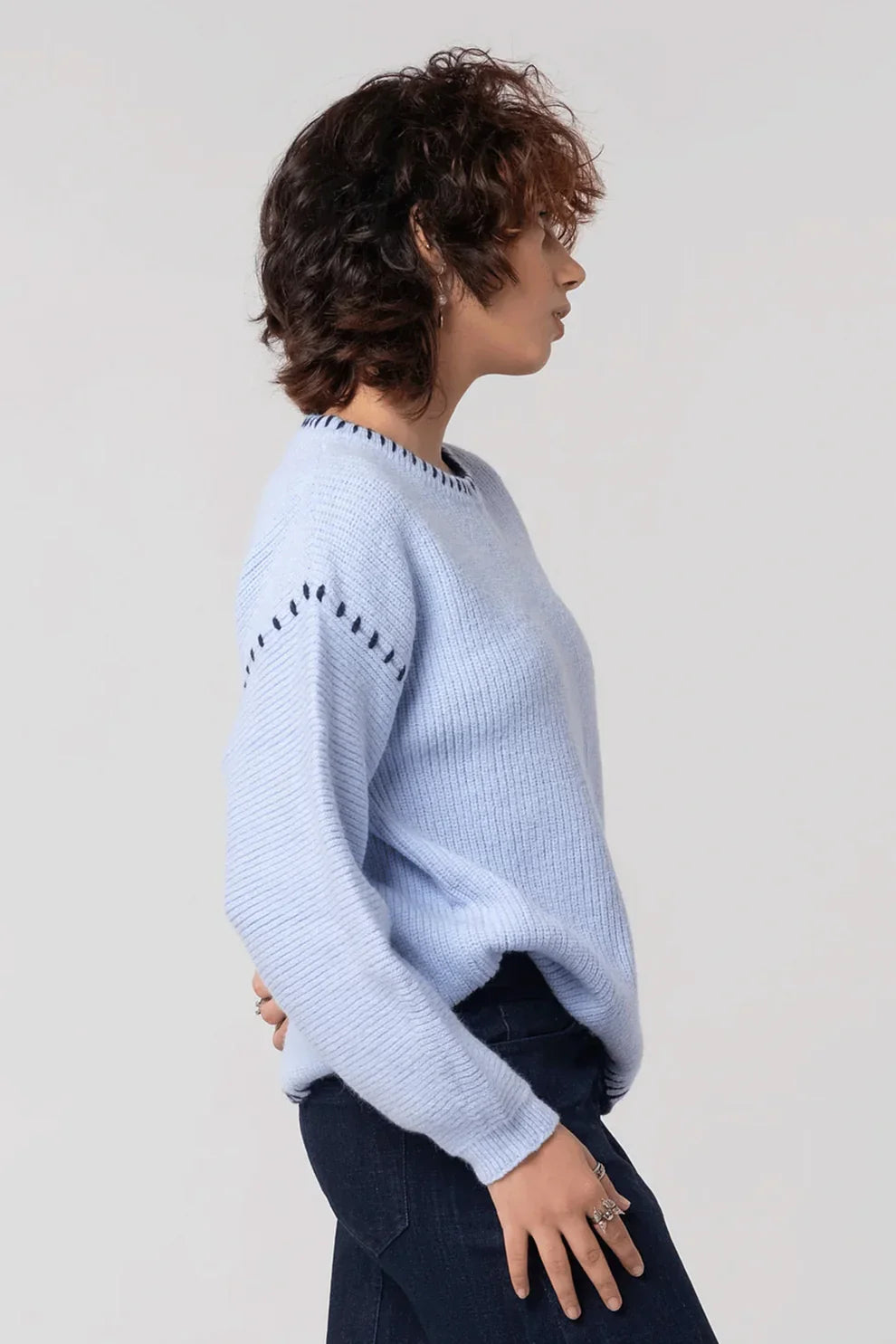 Blue knit cardigan side view