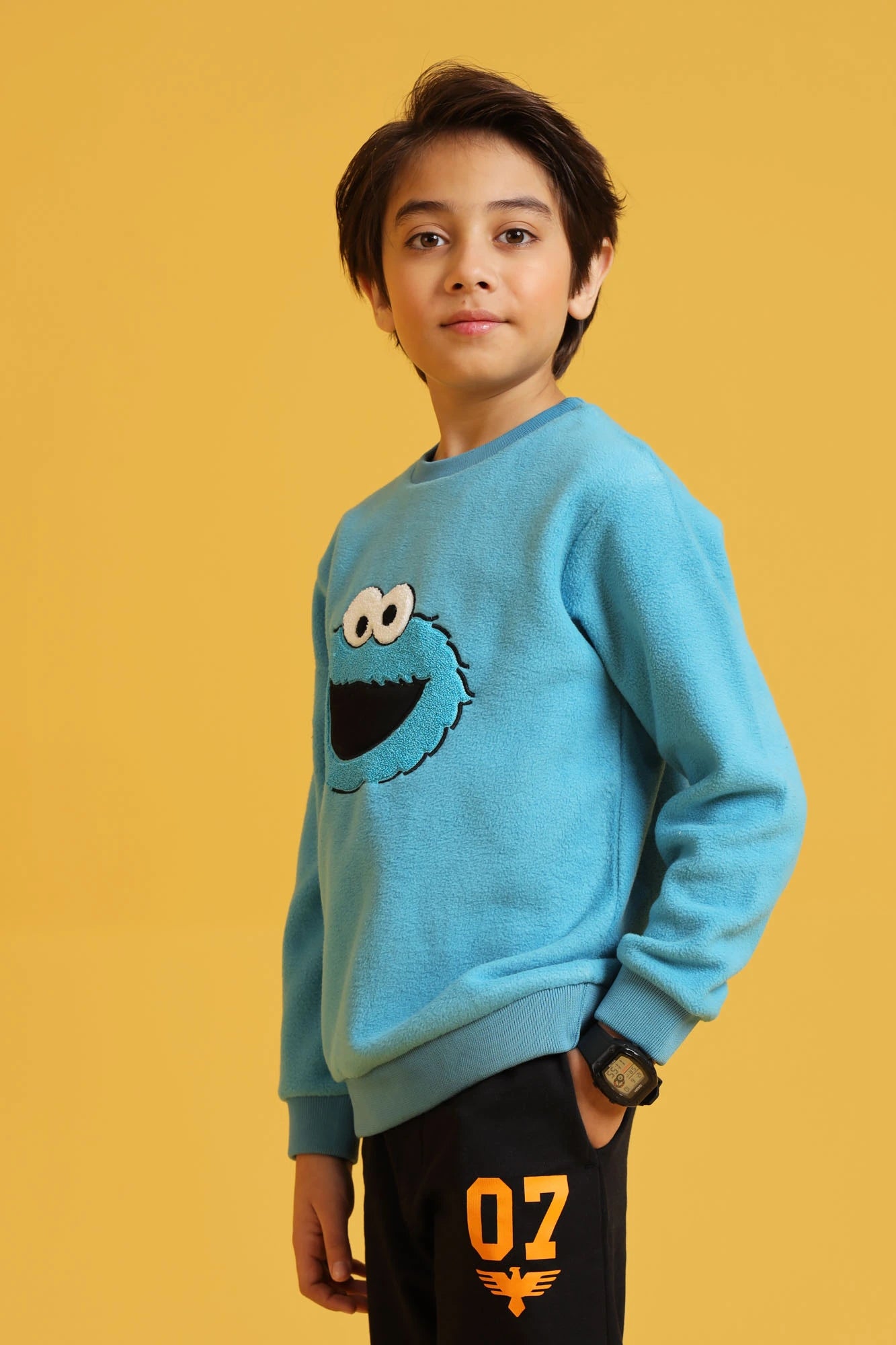 Boy wearing Sweatshirt in Ethereal Blue with embroidered design