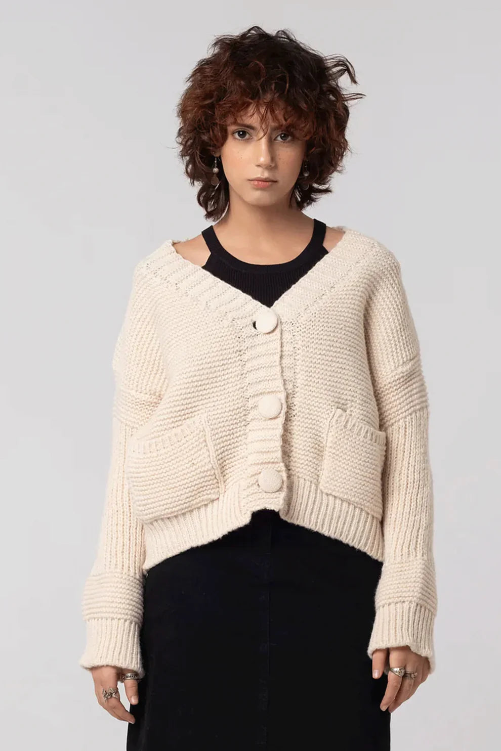 Cardigan over a black top 