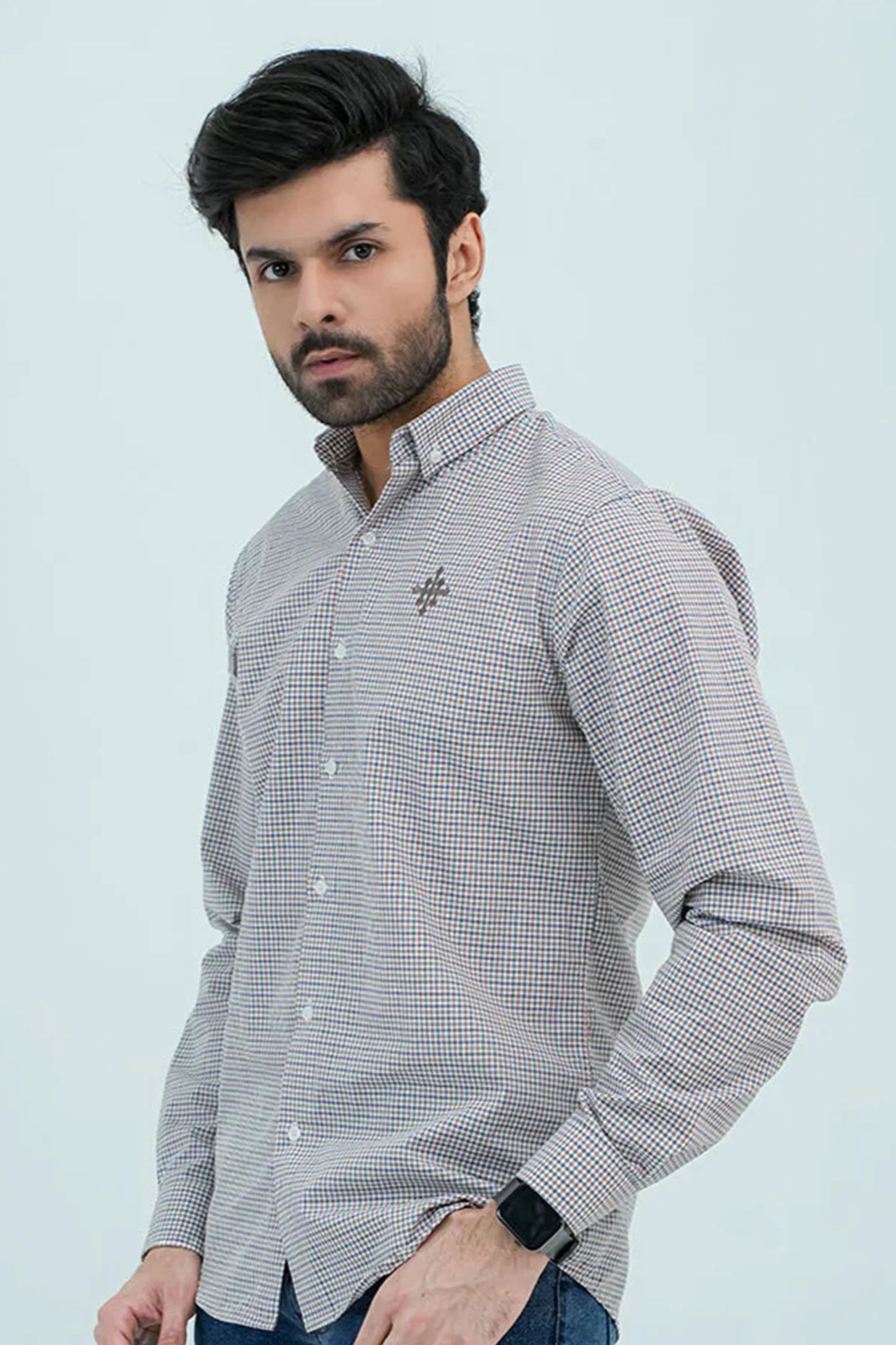 Man wearing checkered brown casual shirt