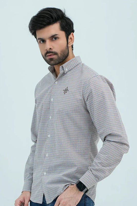 Man wearing checkered brown casual shirt