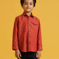 Child wearing a red shirt against a yellow background