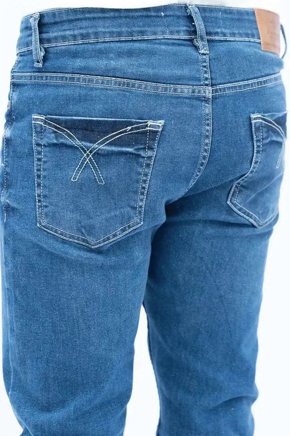 Close-up of a blue jeans on a white background