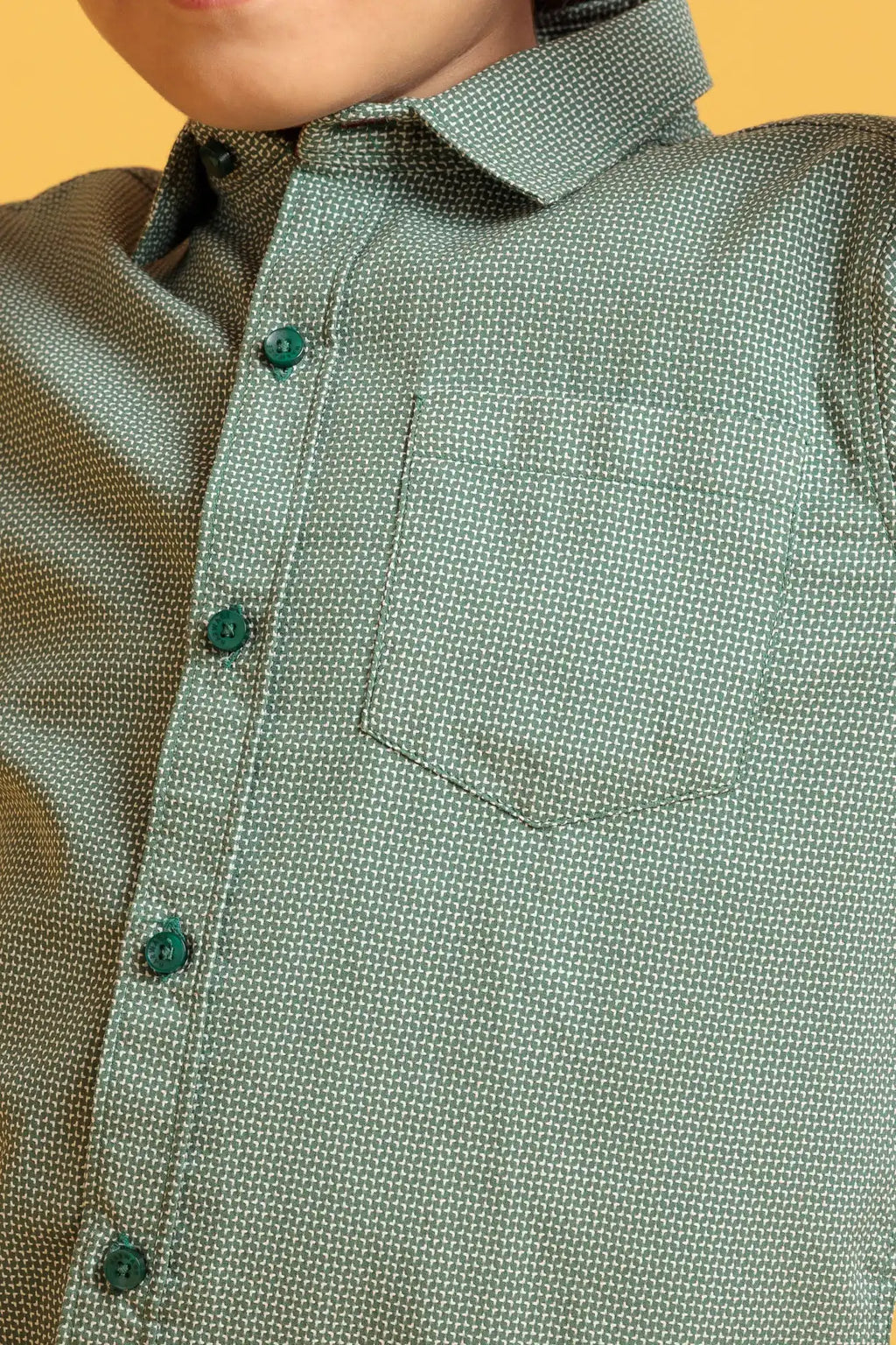 Close-up of a green textured shirt 