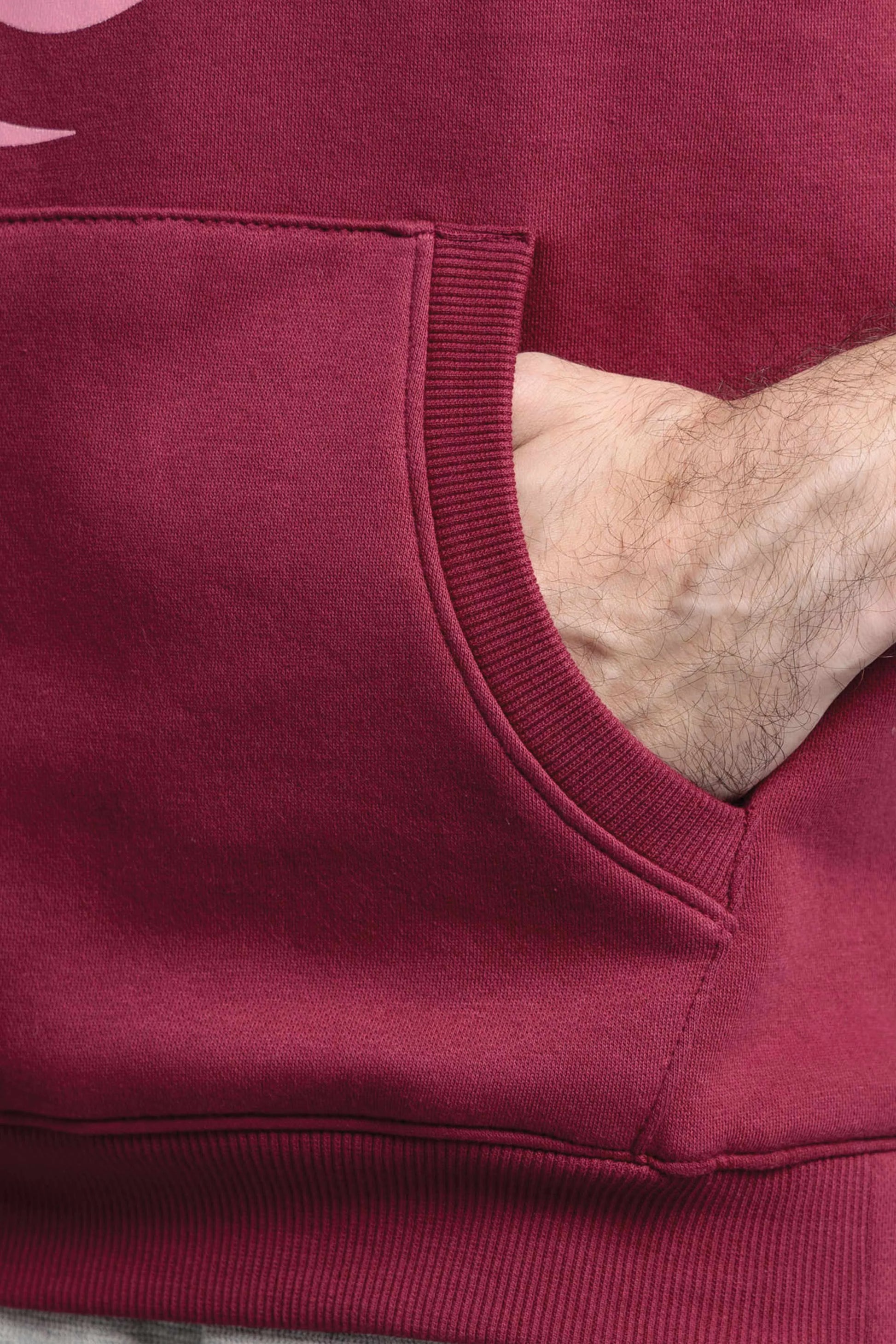 Close-up of a maroon sweatshirt with a pocket
